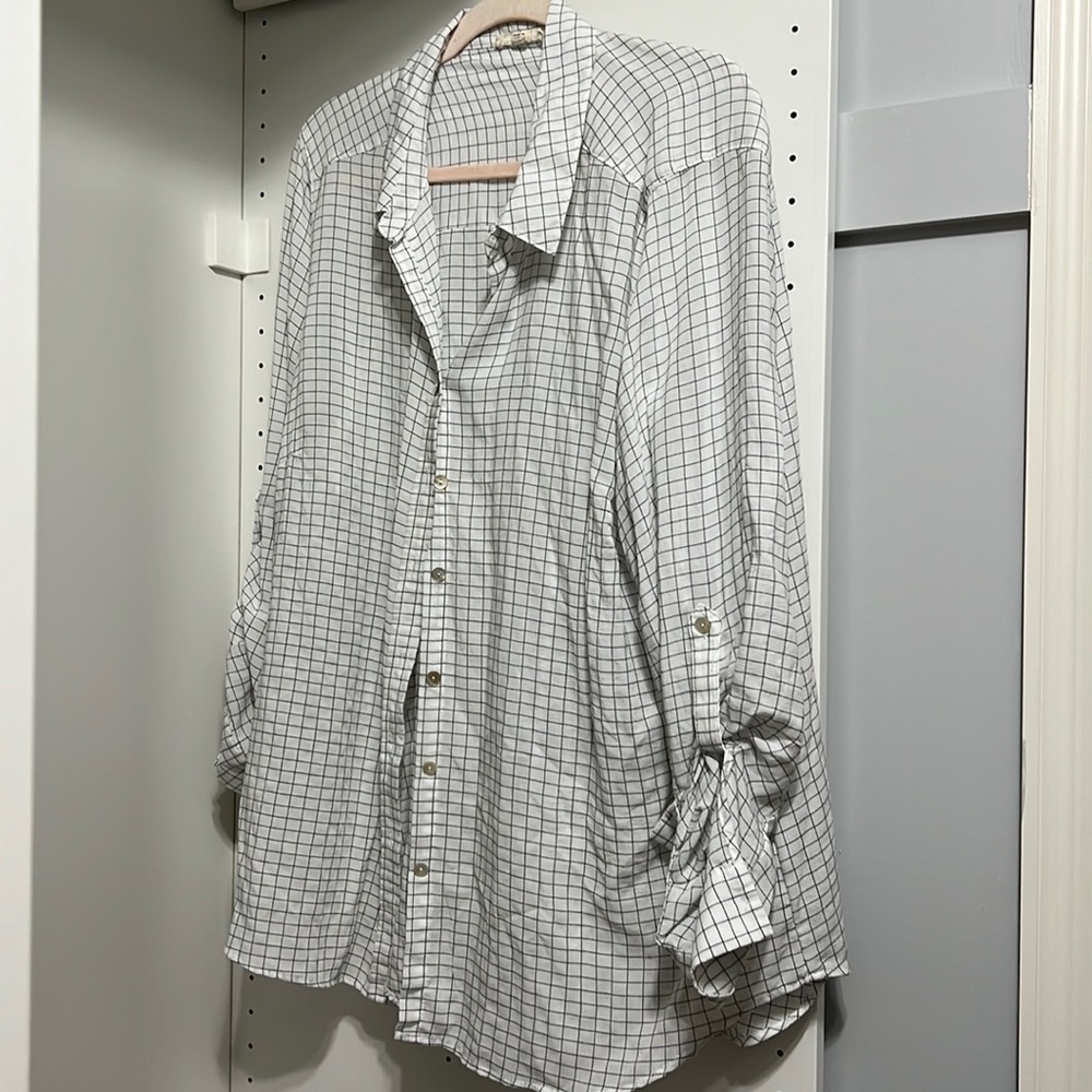 Long sleeved light weight button down blouse.